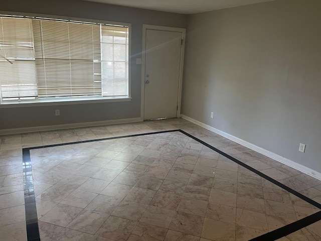 1055 Treadwell St, Memphis, TN 38122 - unfurnished room with marble finish floor and baseboards