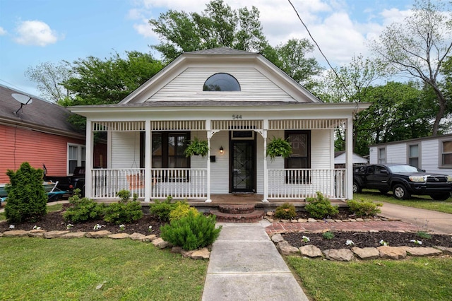 544 Summitt St, Memphis, TN 38104 - neoclassical / greek revival house featuring roof with shingles, a porch, and a front yard