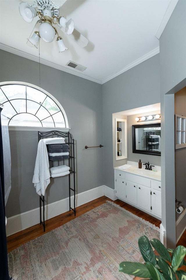 544 Summitt St, Memphis, TN 38104 - bathroom featuring visible vents, baseboards, wood finished floors, and crown molding