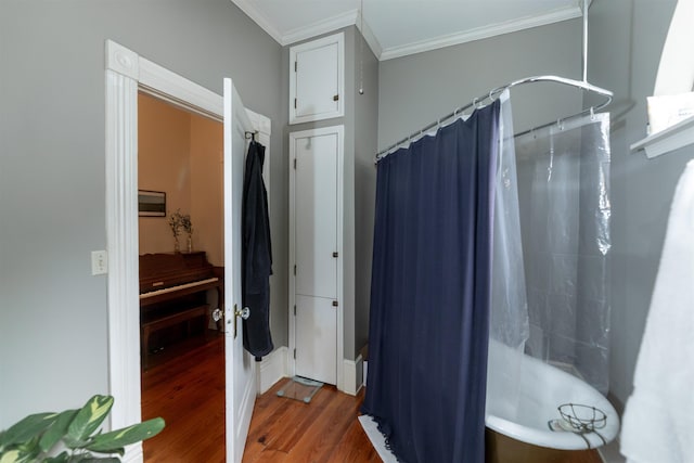 544 Summitt St, Memphis, TN 38104 - bathroom with crown molding, wood finished floors, and curtained shower