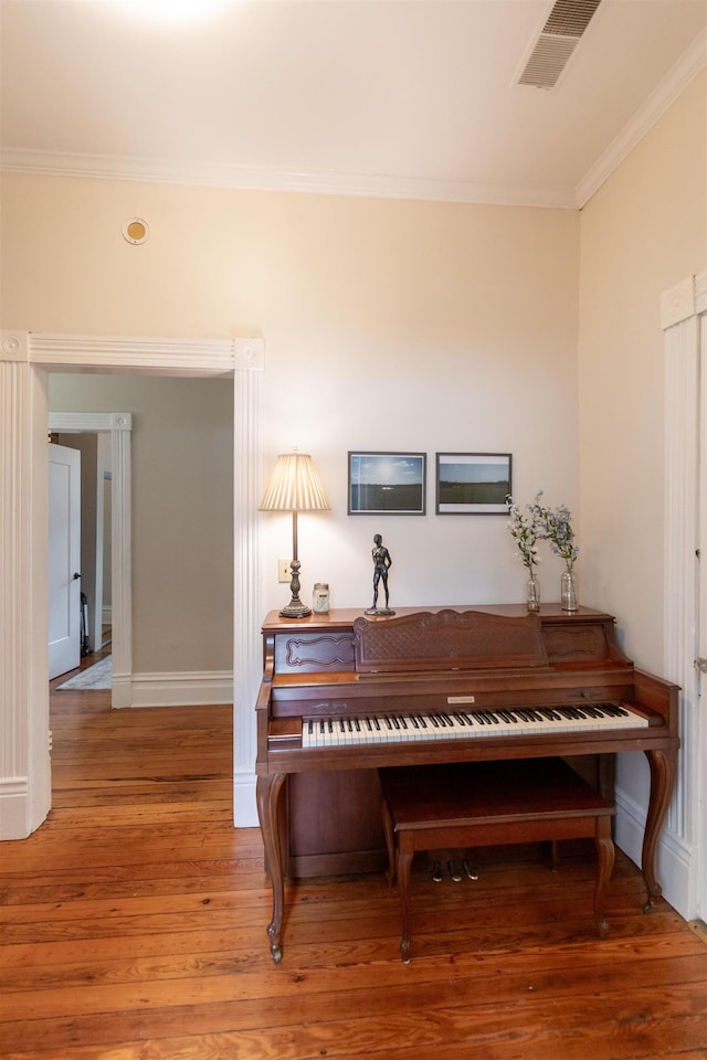 544 Summitt St, Memphis, TN 38104 - interior details with wood finished floors, visible vents, crown molding, and baseboards