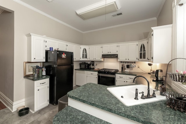 544 Summitt St, Memphis, TN 38104 - kitchen with a sink, freestanding refrigerator, visible vents, gas stove, and crown molding