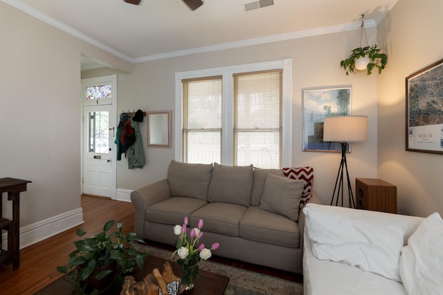 544 Summitt St, Memphis, TN 38104 - living area with visible vents, wood finished floors, a healthy amount of sunlight, and crown molding