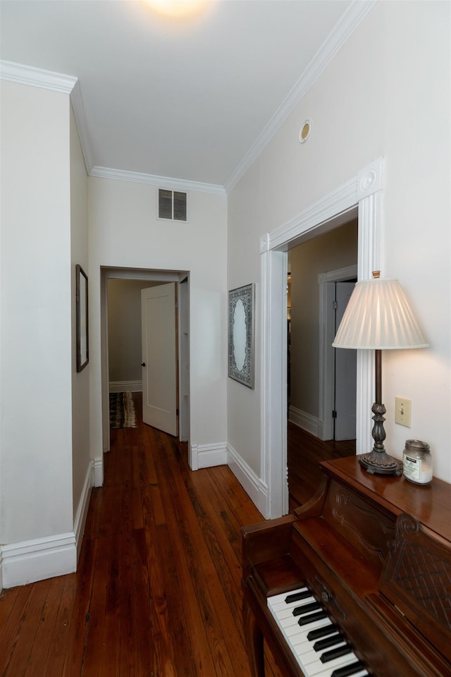 544 Summitt St, Memphis, TN 38104 - hallway featuring baseboards, wood finished floors, visible vents, and crown molding