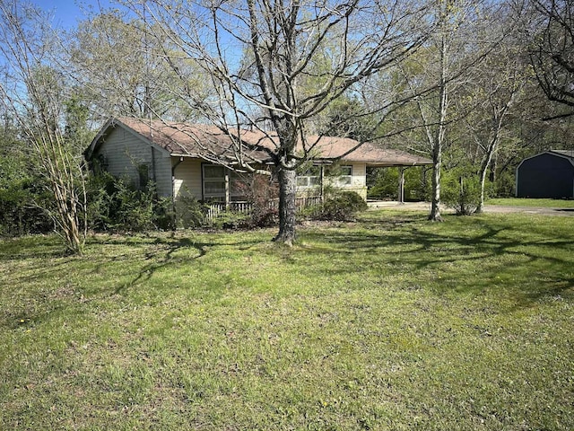 view of yard with an outdoor structure and a shed