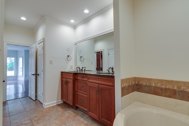 full bathroom with recessed lighting, double vanity, a sink, a bath, and crown molding