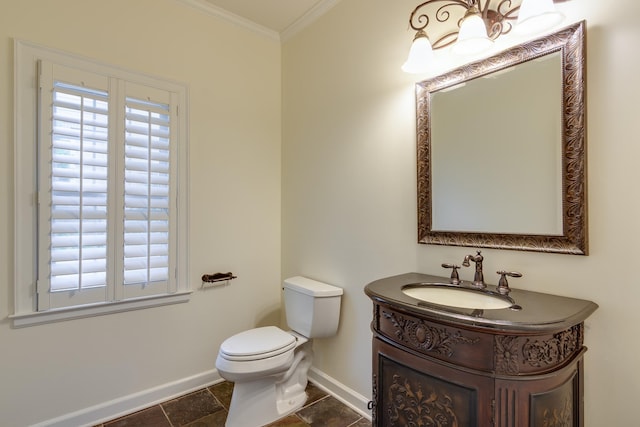 half bathroom with toilet, baseboards, ornamental molding, and vanity