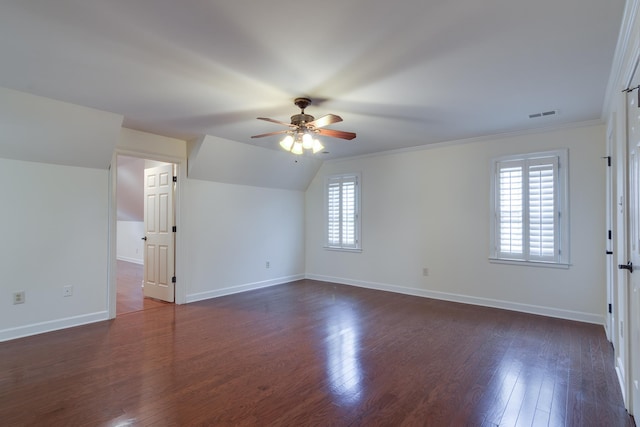 interior space featuring plenty of natural light, visible vents, a ceiling fan, and dark wood-style floors