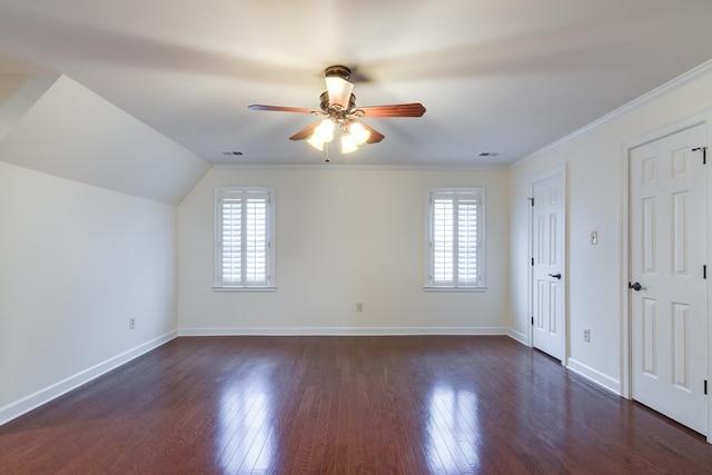 bonus room featuring ceiling fan, dark wood-style floors, visible vents, and plenty of natural light