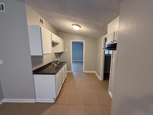 4279 University St, Memphis, TN 38127 - kitchen with white cabinets, visible vents, a sink, and light tile patterned floors