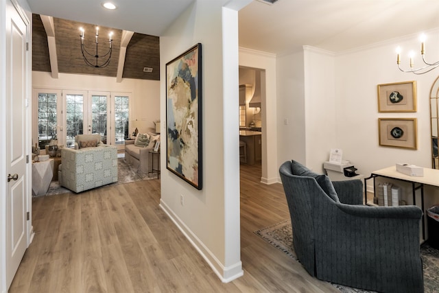 interior space featuring recessed lighting, baseboards, a chandelier, and light wood-style flooring