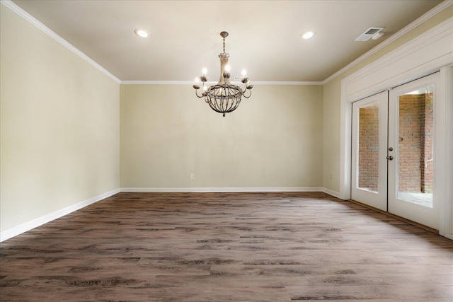 empty room with ornamental molding, french doors, a chandelier, and recessed lighting
