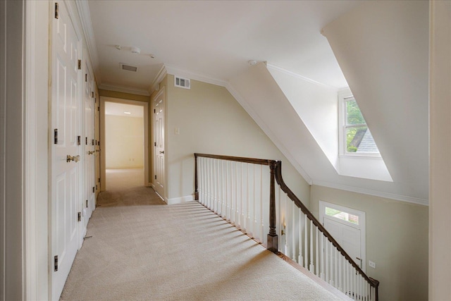 interior space featuring light carpet, a healthy amount of sunlight, vaulted ceiling, and visible vents