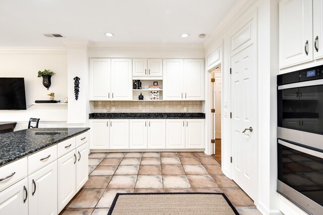 kitchen featuring double wall oven, visible vents, open shelves, and white cabinetry