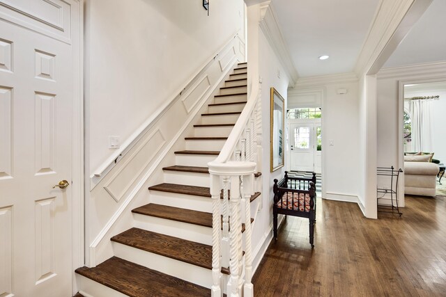 stairs featuring baseboards, wood finished floors, recessed lighting, and crown molding