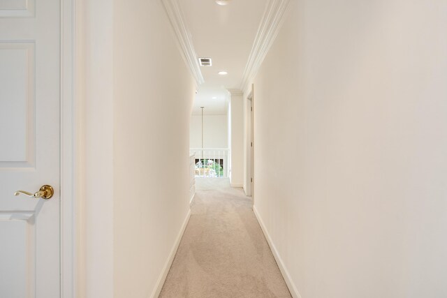 corridor with light carpet, baseboards, visible vents, recessed lighting, and crown molding
