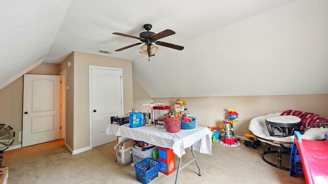 rec room with visible vents, ceiling fan, vaulted ceiling, and carpet floors
