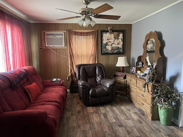 living room featuring an AC wall unit, a ceiling fan, wood finished floors, wooden walls, and ornamental molding
