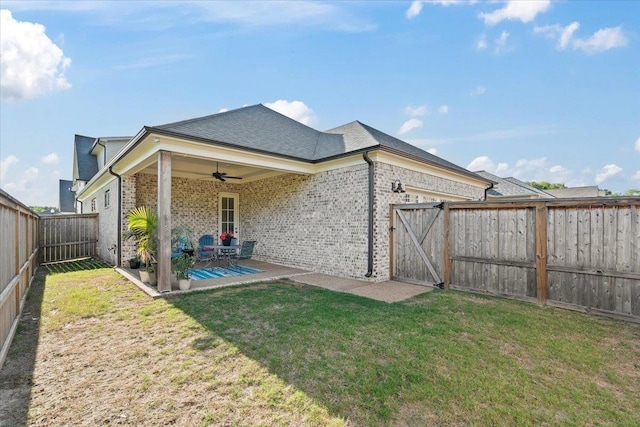 428 Catawba Valley Dr, Collierville, TN 38017 - back of property with a lawn, brick siding, a fenced backyard, and ceiling fan