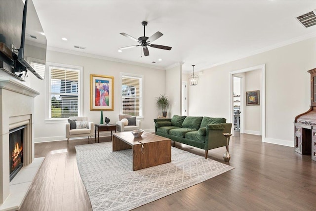 428 Catawba Valley Dr, Collierville, TN 38017 - living area with a warm lit fireplace, visible vents, baseboards, and ceiling fan