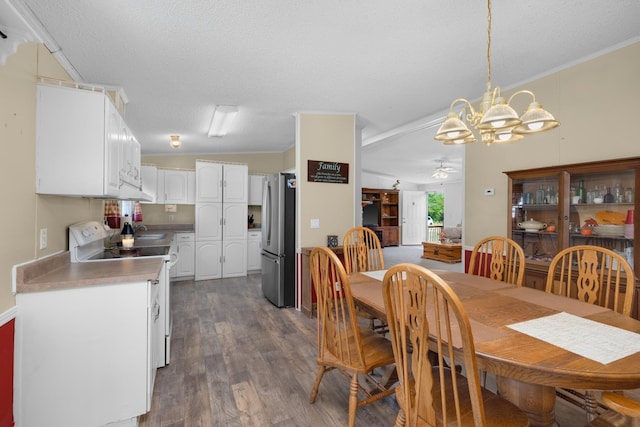 dining area with dark wood finished floors, ornamental molding, a textured ceiling, and ceiling fan with notable chandelier