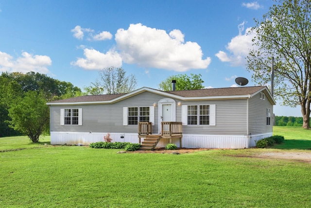 manufactured / mobile home featuring a front lawn