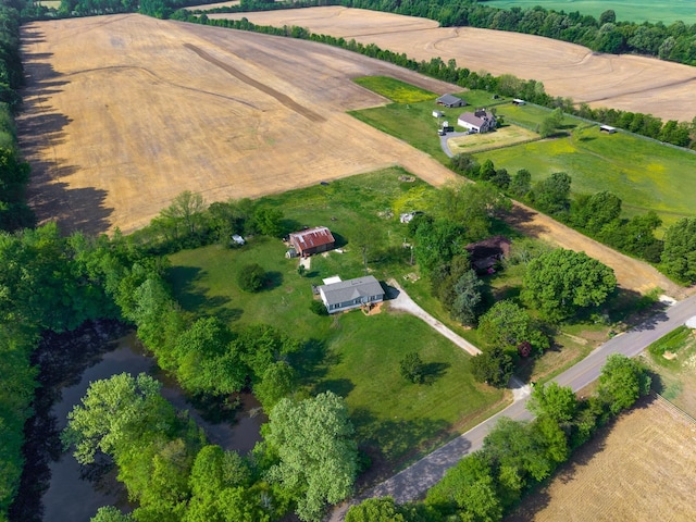birds eye view of property with a rural view and a water view