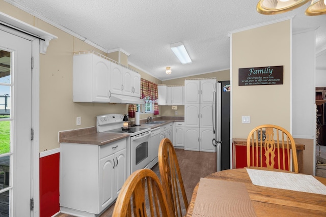 kitchen with ornamental molding, white appliances, white cabinetry, lofted ceiling, and under cabinet range hood