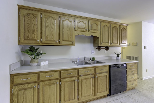 kitchen with a sink, brown cabinets, light tile patterned floors, dishwasher, and light countertops