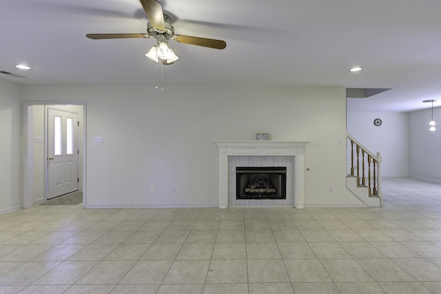 unfurnished living room featuring recessed lighting, stairway, visible vents, light tile patterned floors, and ceiling fan