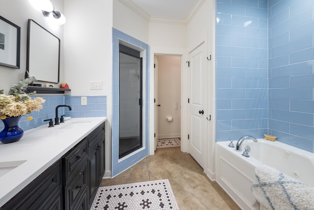 bathroom featuring a bath, a sink, double vanity, a shower stall, and ornamental molding