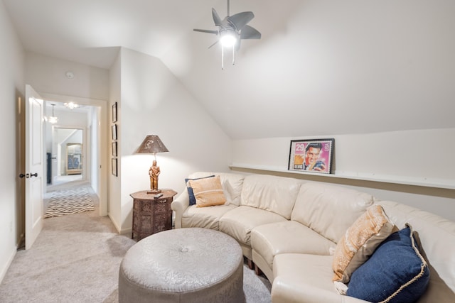 living room with ceiling fan, light carpet, and vaulted ceiling