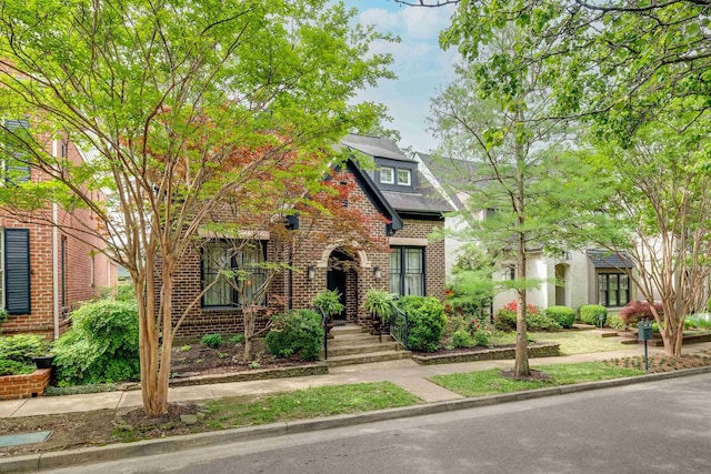 view of front of house featuring brick siding