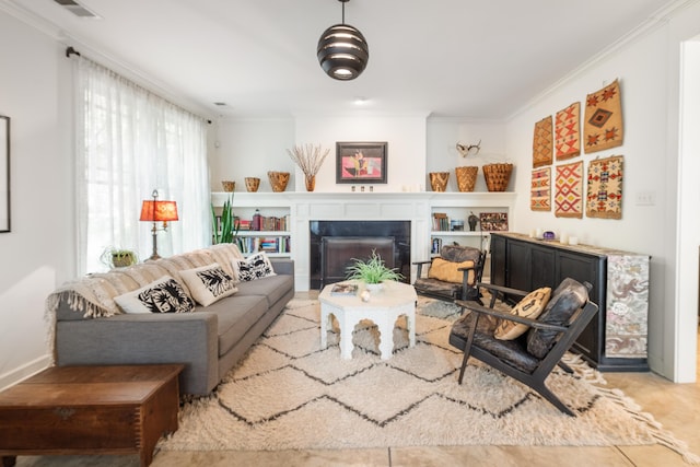 living area with crown molding, visible vents, and a fireplace