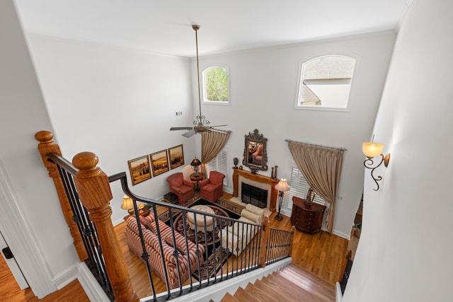 93 Eagle Glade Cv, Cordova, TN 38018 - stairs featuring a fireplace, wood finished floors, ornamental molding, and baseboards