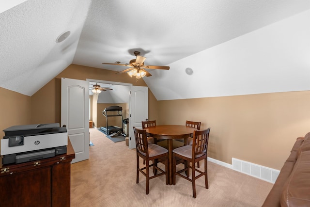 93 Eagle Glade Cv, Cordova, TN 38018 - dining room featuring a ceiling fan, visible vents, a textured ceiling, light colored carpet, and lofted ceiling