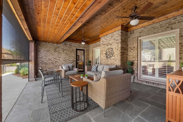 93 Eagle Glade Cv, Cordova, TN 38018 - living area with ceiling fan, brick wall, and stone tile flooring