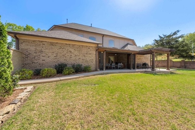93 Eagle Glade Cv, Cordova, TN 38018 - back of property featuring a lawn, fence, a patio, and brick siding