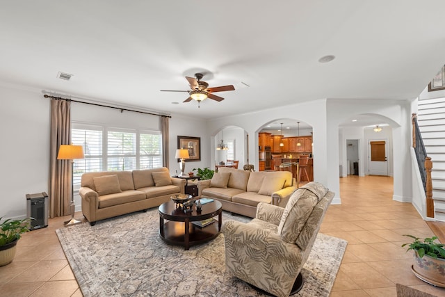 93 Eagle Glade Cv, Cordova, TN 38018 - living area with light tile patterned floors, visible vents, ceiling fan, and arched walkways