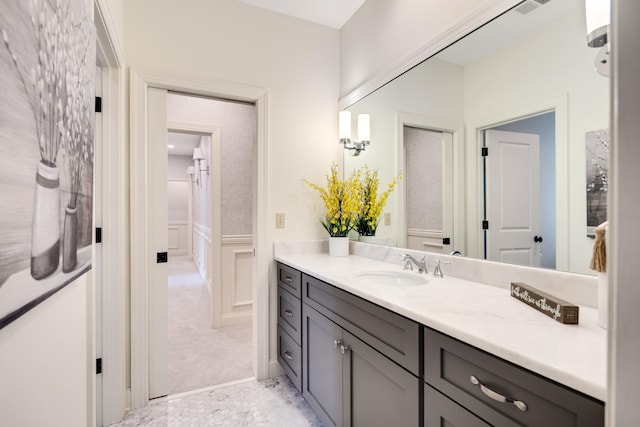 bathroom featuring wainscoting and vanity