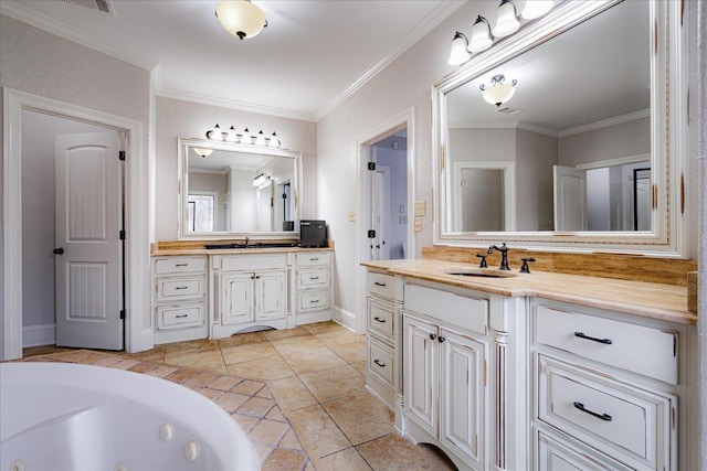 full bathroom featuring ornamental molding, two vanities, a sink, and baseboards