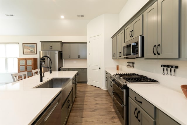 kitchen featuring appliances with stainless steel finishes, visible vents, light countertops, and recessed lighting