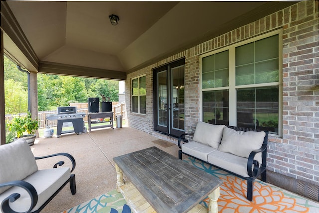 view of patio with outdoor lounge area and a grill