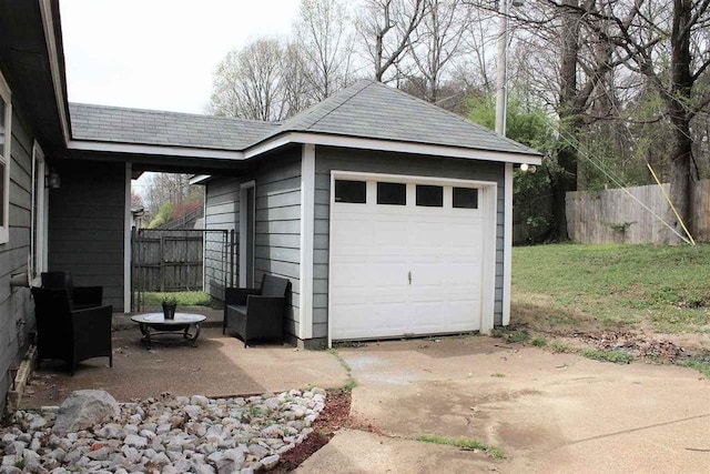 garage featuring fence