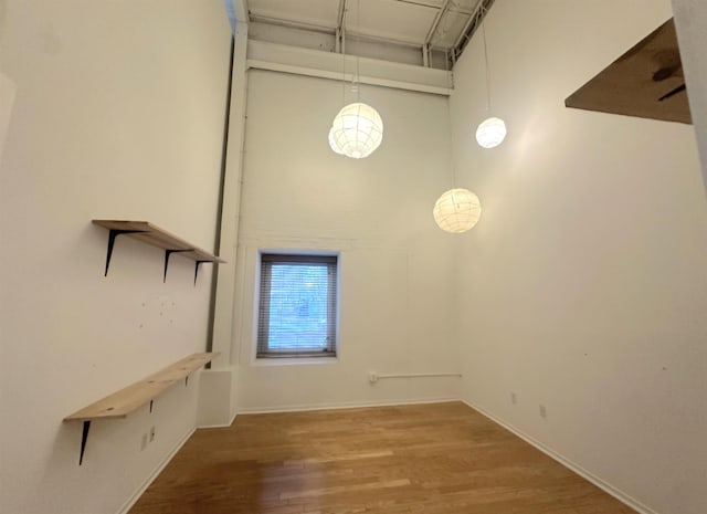 415 S Front St Unit 120, Memphis, TN 38103 - interior space featuring baseboards, wood finished floors, and a high ceiling
