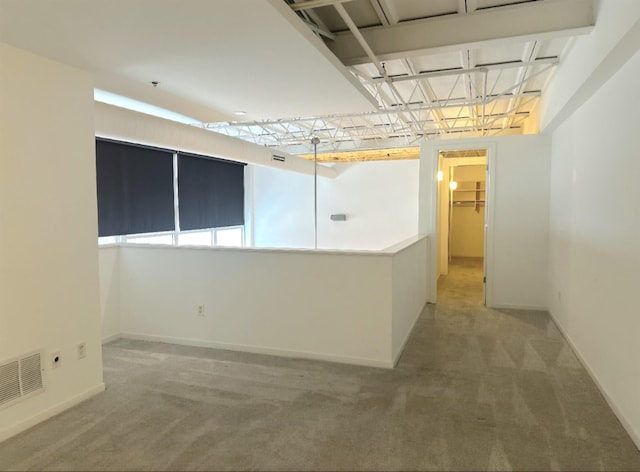 415 S Front St Unit 120, Memphis, TN 38103 - unfurnished room featuring baseboards, visible vents, and light colored carpet