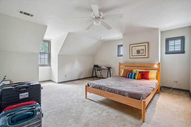 carpeted bedroom with baseboards, visible vents, and multiple windows