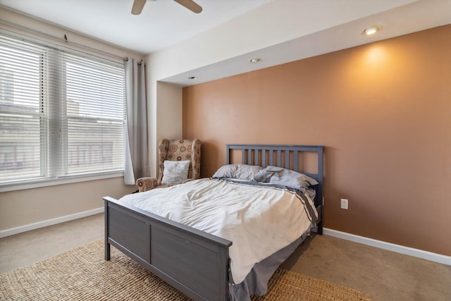 bedroom featuring carpet floors, baseboards, and ceiling fan