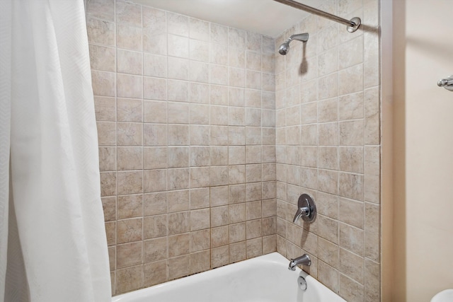 bathroom featuring shower / tub combo with curtain