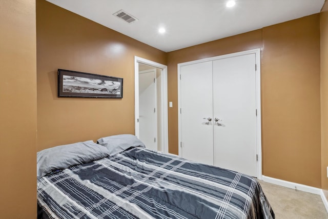 carpeted bedroom with visible vents, recessed lighting, baseboards, and a closet